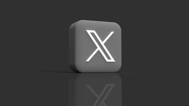 Het X-logo op een enkele knop op een grijze achtergrond.